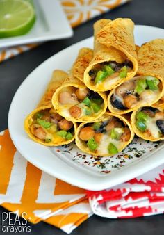 a white plate topped with tortillas and vegetables