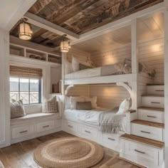 a bedroom with bunk beds and drawers in it