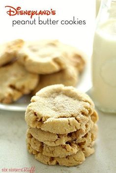 peanut butter cookies stacked on top of each other next to a glass of milk