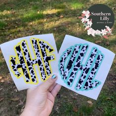 two handmade cards with the letters h and w in black, yellow and blue