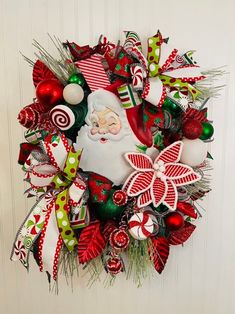 a christmas wreath with santa clause and candy canes