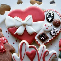 decorated cookies in the shape of heart and love