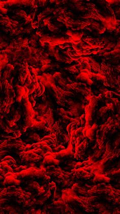 an abstract red and black background that looks like something out of space or in the sky