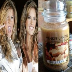 two women posing next to a jar of maple sugar