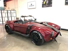 a red sports car parked in a garage