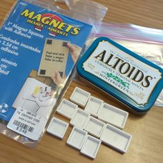 the contents of a magnets making kit are displayed on a wooden table with plastic packaging