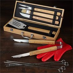 a set of kitchen utensils in a wooden box