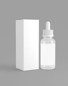 a white bottle with a dropper next to a cardboard box on a gray background