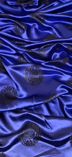 the blue silk has gold designs on it