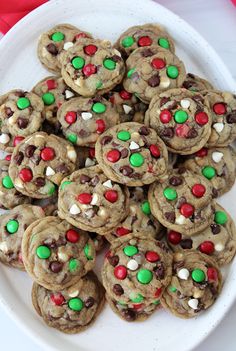 a white plate topped with cookies and m & m's