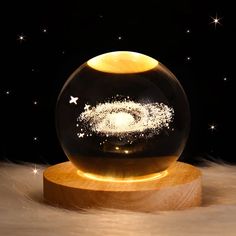 a snow globe with stars in the background