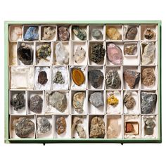 a box filled with lots of different types of rocks and stones on top of each other