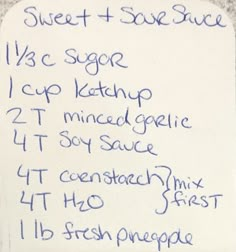 a white sign with blue writing on it that says sweet and sour sauce 1 / 3 scoop cup ketchup 2t mixed garlic 4t soy sauce