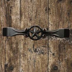 an old door handle with a star on it