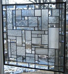 a close up of a glass window with many different designs