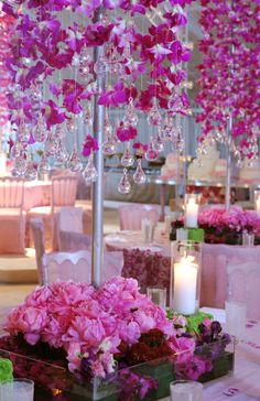 purple flowers hanging from the ceiling in a room