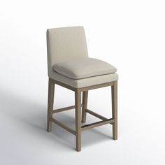 an image of a chair that is made out of wood and upholstered with fabric