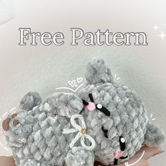 a crocheted gray teddy bear sitting on top of someone's hand with the caption free pattern