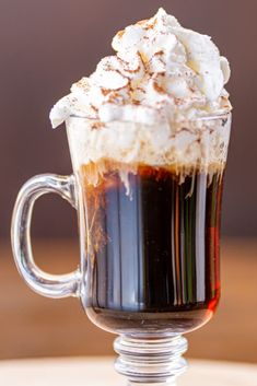 Clear coffee mug topped with whipped cream. Jameson Whiskey Drinks, Coffee Whip, Whiskey And Ginger Ale, Coffee Whipped Cream, Whiskey Drinks Recipes, Peanut Butter Whiskey, Whiskey Chocolate, Irish Coffee Recipe, Whiskey Cream