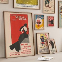 there are many vintage posters on the wall