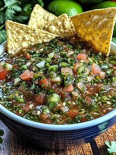 a bowl filled with salsa and tortilla chips