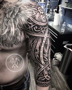 a man's half sleeve with an intricate design on his left arm and chest