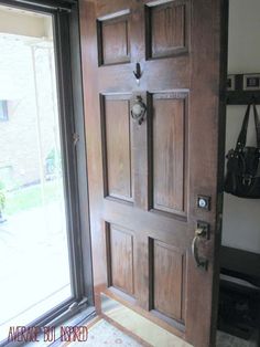 an open wooden door in front of a window