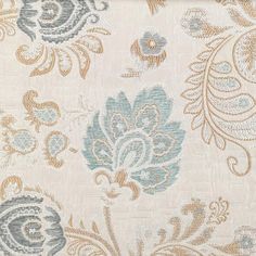 an upholstered fabric with blue and gold flowers on it