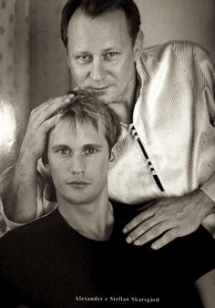 an image of two men posing for a photo on the cover of a magazine or book