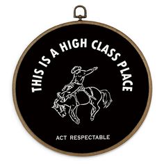 this is a high class place sign with a horse and rider on it's back