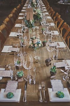 an image of a table set up for a wedding with place settings on the table