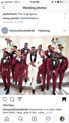 a group of men in red tuxedos standing next to each other