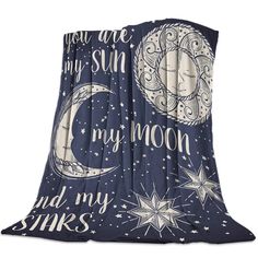 a blanket with the words you are my sun and my moon on it in blue