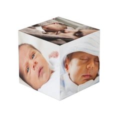 a cube shaped box with a baby's photo on the front and back side