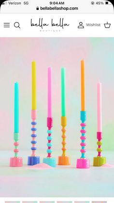 the candles are lined up in different colors and sizes, with one candle sticking out of each other