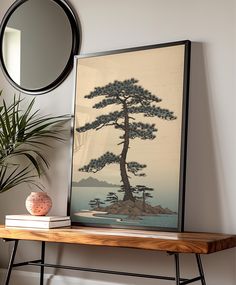 a table with a mirror, vase and painting on it next to a potted plant