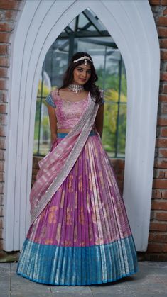 a woman in a purple and blue dress