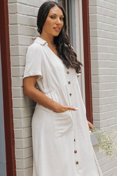 This versatile Oatmeal Button Down Linen Midi Dress is a must-have for any wardrobe! Its collared V-neck and button-down design add a touch of sophistication, while the large front pockets provide functionality and convenience. Made from high-quality linen, this dress offers both comfort and stylish elegance! Style it with sneakers or comfy sandals for a casual but chic everyday outfit. Comfy Sandals, Linen Midi Dress, Button Downs, Everyday Outfits, Must Haves, Oatmeal, Midi Dress, V Neck, Wardrobe