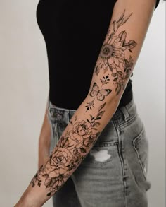 a woman's arm with flowers on it