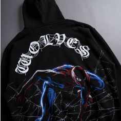 a spiderman hoodie with the word's logo on it and an image of a