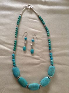 a necklace and earring set with turquoise beads