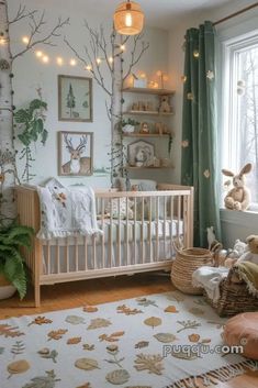 a baby's room decorated in white and green with lots of trees on the wall