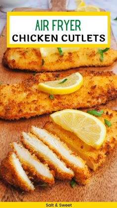 air fryer breaded chicken on a cutting board with lemons and parsley