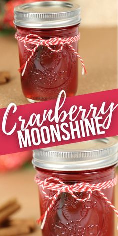 two mason jars filled with cranberry moonhines on top of a table