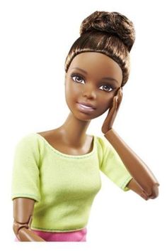 a barbie doll holding a cell phone to her ear