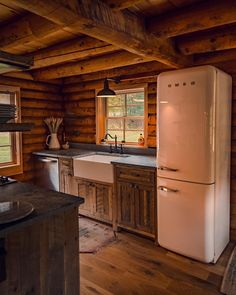 a white refrigerator freezer sitting inside of a kitchen