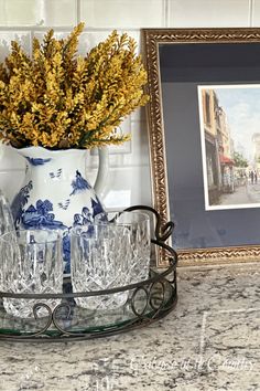 gold stems in blue and white pitcher on glass tray with traditional art print in gold frame Fall Console Table Decor Ideas, Simple Fall Aesthetic, Colors With Navy Blue, Fall Console Table Decor, For The Home Ideas, Fall Family Room, Kitchen Tour