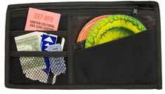 an open black wallet with money and plates in it