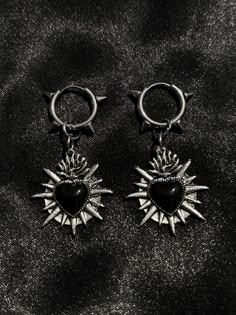 silver & black punk spike hoop sacred heart earrings || gothic jewellery || gothic || alternative || goth || vampire || witch || halloween jewellery || alt jewellery ♱ stainless steel hooks ♱ tibetan silver alloy pendants ♱ please keep this item away from water, oils & perfumes to preserve the quality ♱ £1.55 2nd class royal mail shipping on all orders to the uk, shipping available for eu ♱ if you experience any issues with your order, please do not hesitate to contact me, i'll always be happy to help. additionally any questions just ask :) vampiremoonjewellery Vampire Goth Accessories, Gothic Silver Earrings, Diy Goth Earrings, Goth Accessories Jewellery, Techno Goth, Halloween Jewellery, Alt Jewelry, Goth Jewellery, Spooky Jewelry