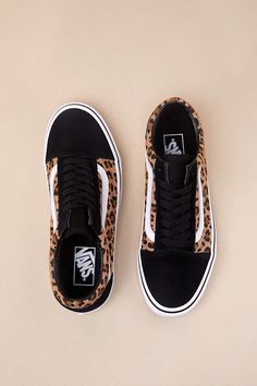 Grab the Vans Old Skool Animalier Black Suede Lace-Up Sneakers anytime you want to look casually iconic! Durable canvas fabric (with a trendy leopard print throughout) and genuine suede leather come together to shape these must-have kicks with a rounded toe upper and a lace-up vamp with black laces. The signature Sidestripeâ„¢ accents the insole and outsole. Low-cut, padded collar tops a sturdy bumper sole that features the classic waffle outsole! Logo tag at the heel. 1" rubber heel. Cushioned Logo Tag, Suede Lace, Collar Top, Vans Old Skool, Rubber Heels, Black Laces, Old Skool, Low Cut, Black Suede